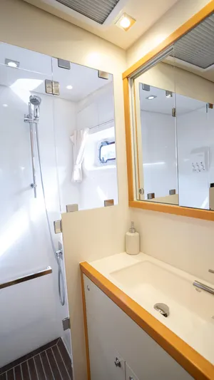 Copper Penny Yacht Photos Pics Modern bathroom in 2011 Lagoon 560 yacht with shower and mirrored cabinet.