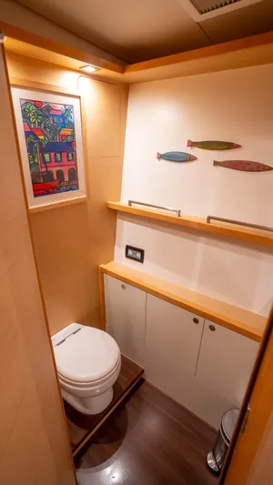 Copper Penny Yacht Photos Pics Compact bathroom in 2011 Lagoon 560 yacht with modern decor and artwork.