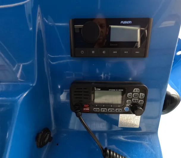 Cool Change Yacht Photos Pics Control panel on a 2022 Eastward 30 boat featuring Fusion and Icom marine electronics.