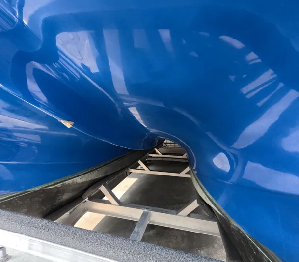 Cool Change Yacht Photos Pics Blue Eastward 30 boat hull on trailer, 2022 model, close-up view.