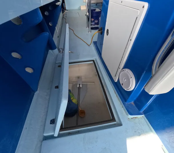 Cool Change Yacht Photos Pics Open hatch on Eastward 30 boat deck, revealing storage compartment, 2022 model.