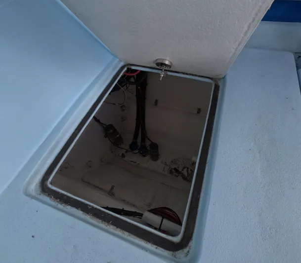 Cool Change Yacht Photos Pics Open hatch of 2022 Eastward 30 boat, showing interior wiring and components.