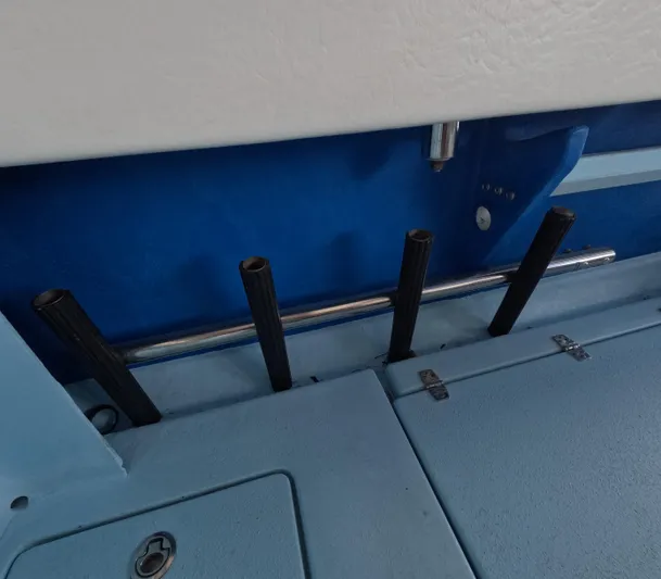Cool Change Yacht Photos Pics Interior of 2022 Eastward 30 boat showing rod holders and storage compartment.