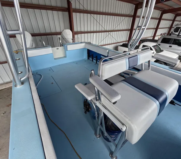 Cool Change Yacht Photos Pics Interior of 2022 Eastward 30 boat with blue and white seating in storage.