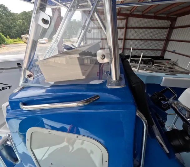 Cool Change Yacht Photos Pics 2022 Eastward 30 boat with blue exterior, parked in a covered storage area.
