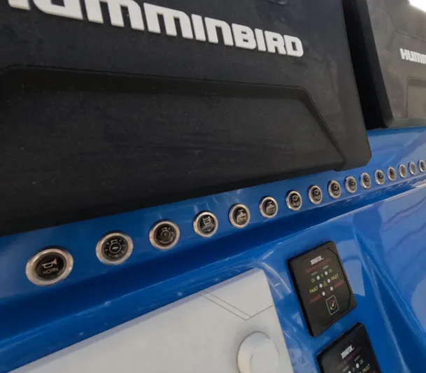 Cool Change Yacht Photos Pics Control panel of 2022 Eastward 30 boat with Humminbird electronics and various buttons.