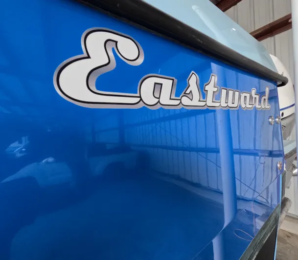 Cool Change Yacht Photos Pics Blue Eastward 30 boat with logo, 2022 model, in a storage facility.