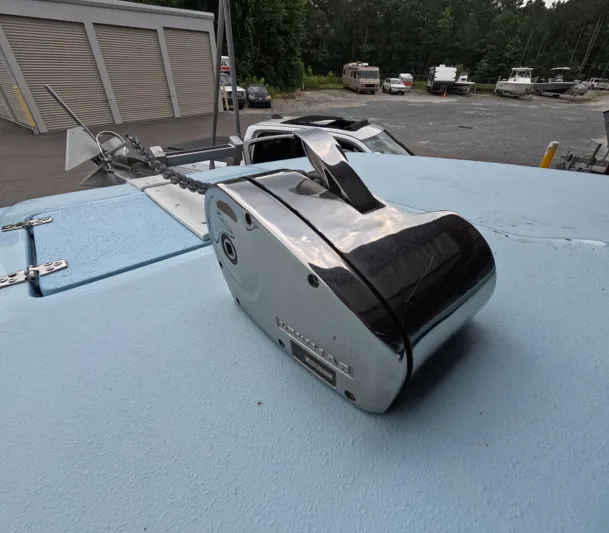 Cool Change Yacht Photos Pics Chrome anchor winch on 2022 Eastward 30 boat deck, parked near storage facility.