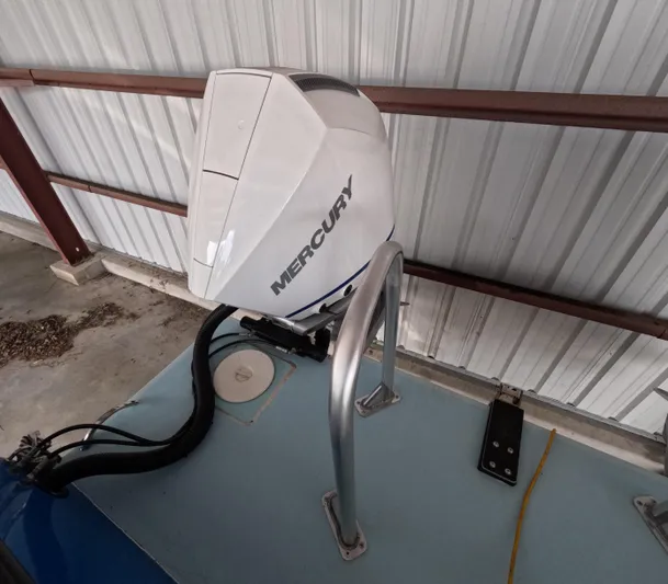 Cool Change Yacht Photos Pics Mercury outboard motor on 2022 Eastward 30 boat, stored indoors.