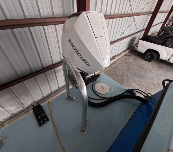 Cool Change Yacht Photos Pics Outboard motor on 2022 Eastward 30 boat in storage facility.