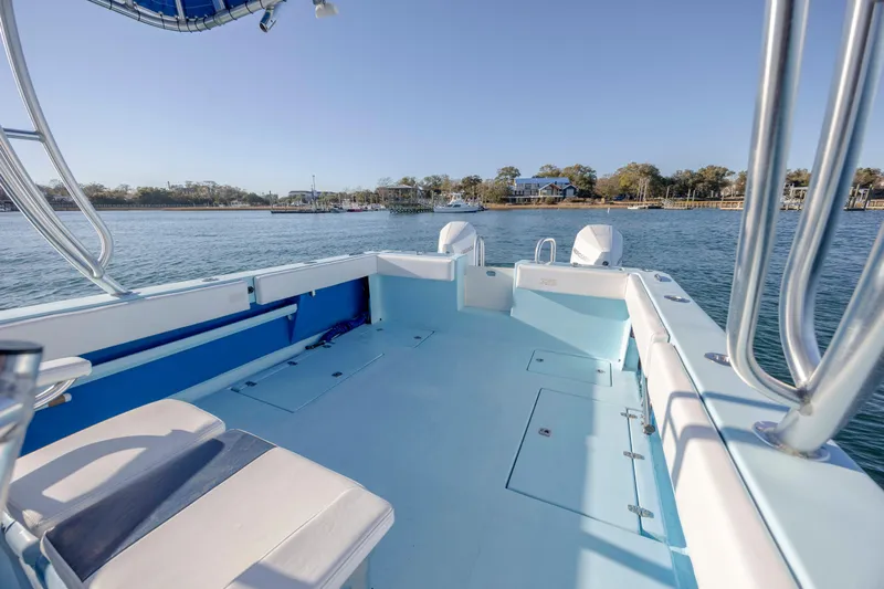 Cool Change Yacht Photos Pics Open deck of 2022 Eastward 30 boat with scenic waterfront view.