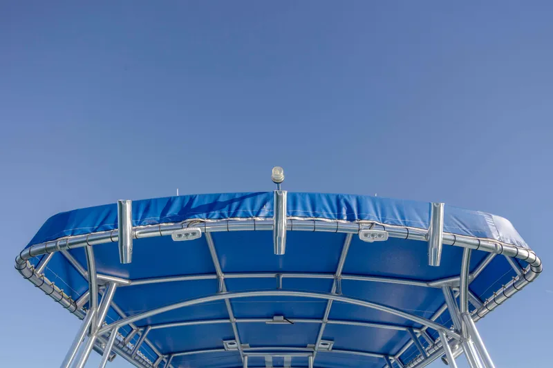 Cool Change Yacht Photos Pics Blue canopy of 2022 Eastward 30 boat against clear sky.