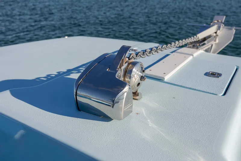 Cool Change Yacht Photos Pics Anchor chain mechanism on 2022 Eastward 30 boat, with water in the background.