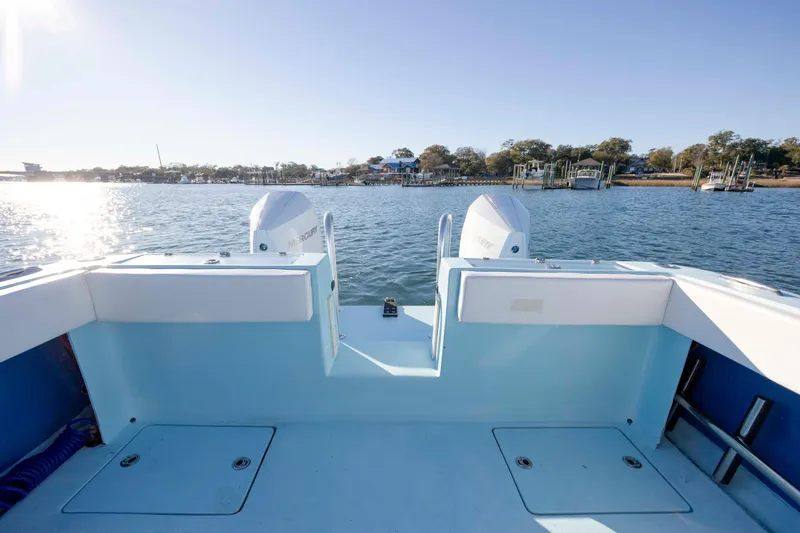 Cool Change Yacht Photos Pics 2022 Eastward 30 boat with dual Mercury engines on a sunny day.
