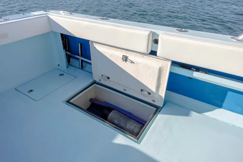 Cool Change Yacht Photos Pics Open storage compartment on 2022 Eastward 30 boat deck, with ocean view.