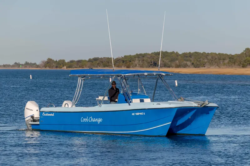 Cool Change Yacht Photos Pics Blue 2022 Eastward 30 boat named "Cool Change" on calm water.