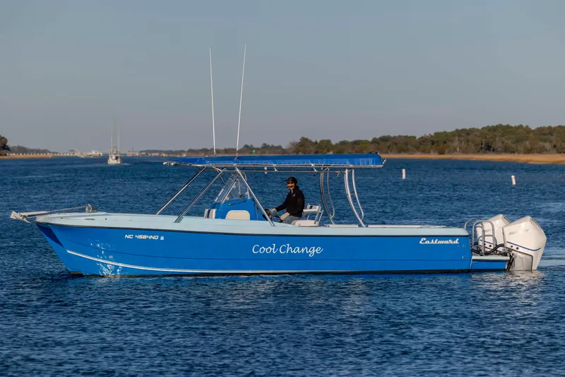 Cool Change Yacht Photos Pics Blue 2022 Eastward 30 boat named "Cool Change" cruising on calm water.