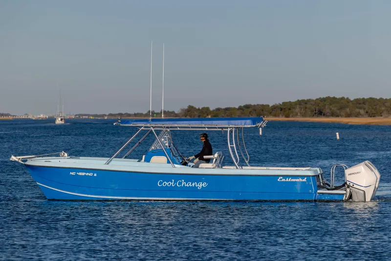 Cool Change Yacht Photos Pics Blue 2022 Eastward 30 boat named "Cool Change" cruising on calm water.