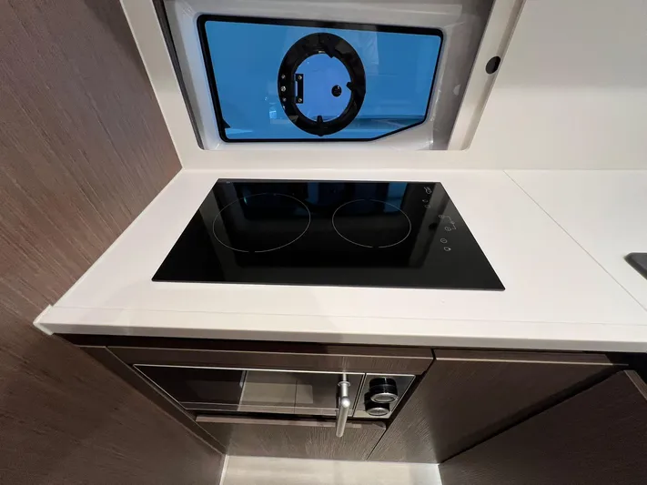 Sealine S390 Yacht Photos Pics Modern kitchen in 2022 Sealine S390 yacht with stove and oven.