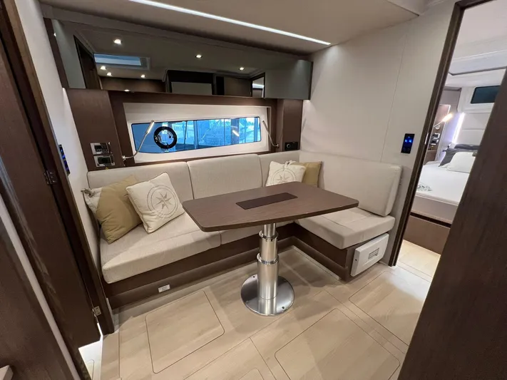 Sealine S390 Yacht Photos Pics Luxurious interior of 2022 Sealine S390 yacht with elegant seating and modern design.