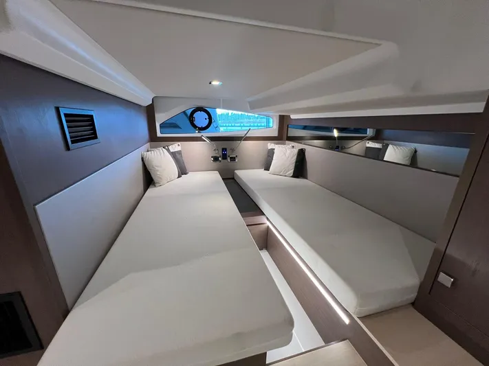 Sealine S390 Yacht Photos Pics Interior of 2022 Sealine S390 yacht cabin with twin beds and modern design.