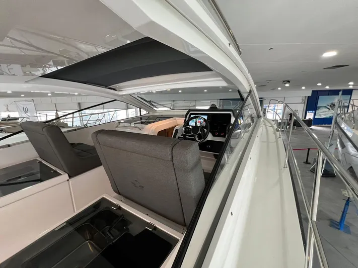 Sealine S390 Yacht Photos Pics 2022 Sealine S390 yacht interior with modern helm and seating.