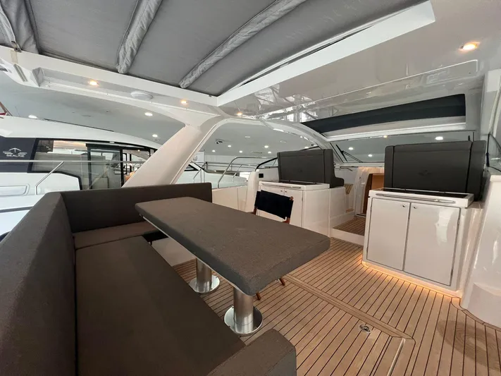 Sealine S390 Yacht Photos Pics 2022 Sealine S390 yacht interior with modern seating and sleek design.