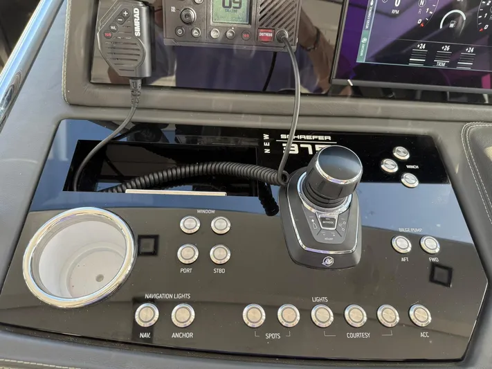 Moana & Malie Yacht Photos Pics Control panel of a 2025 Schaefer 375 yacht with navigation and communication equipment.