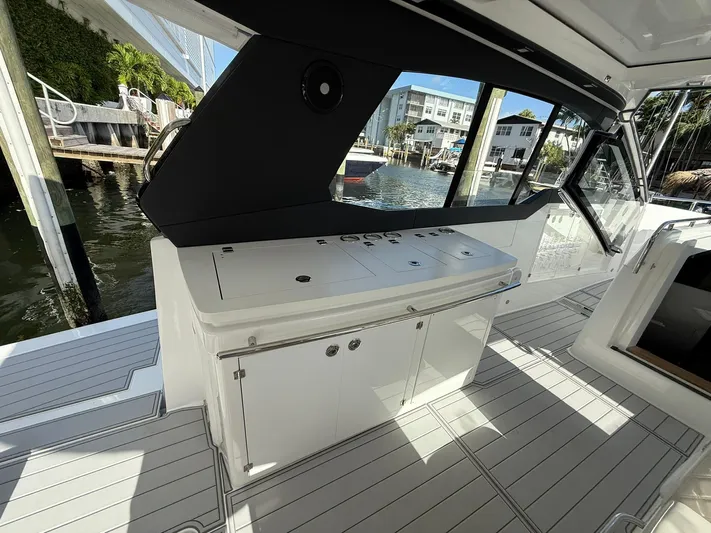 Moana & Malie Yacht Photos Pics 2025 Schaefer 375 yacht interior with sleek cabinetry and waterfront view.