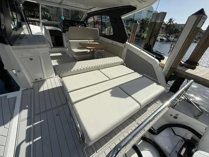 Moana & Malie Yacht Photos Pics 2025 Schaefer 375 yacht interior with luxurious seating and modern design at a marina.