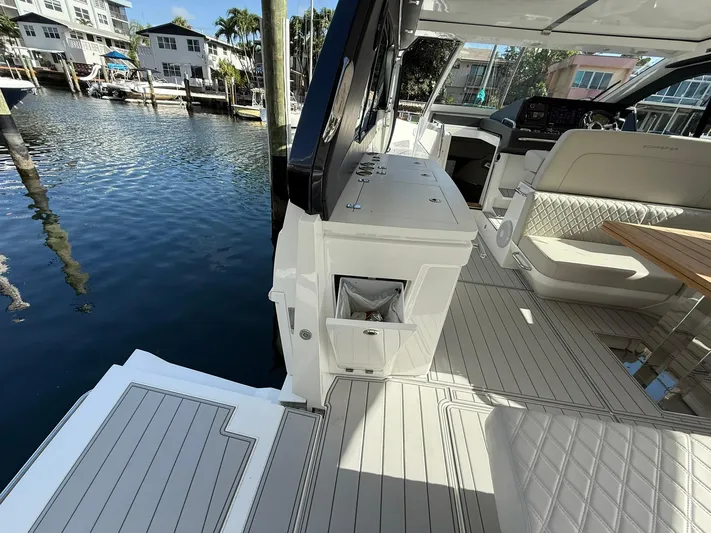 Moana & Malie Yacht Photos Pics Luxurious 2025 Schaefer 375 yacht interior with elegant seating and modern amenities by the water.