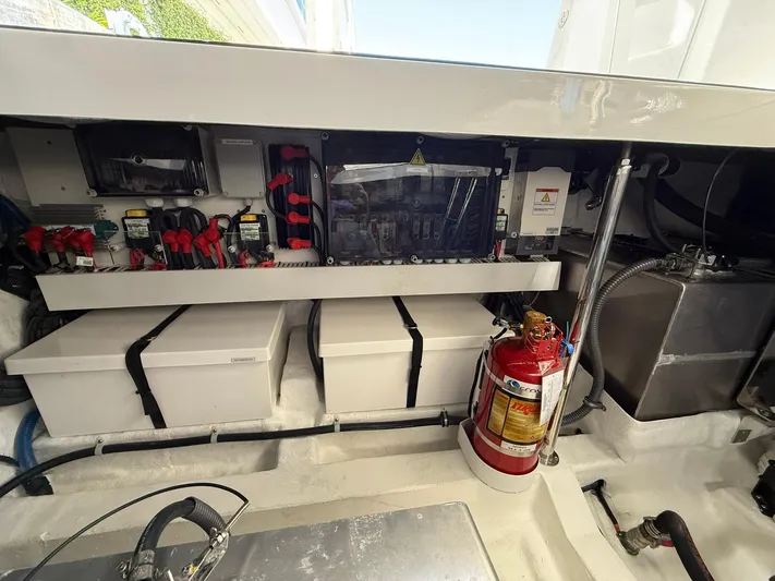 Moana & Malie Yacht Photos Pics Engine compartment of 2025 Schaefer 375 boat with fire extinguisher and electrical components.