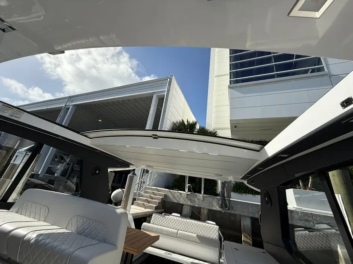 Moana & Malie Yacht Photos Pics Interior view of 2025 Schaefer 375 yacht with open roof and modern seating.