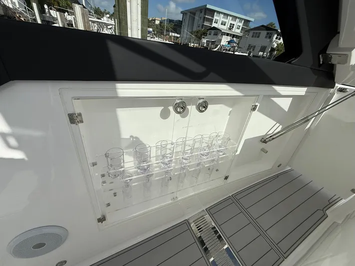 Moana & Malie Yacht Photos Pics Interior of 2025 Schaefer 375 yacht with glass holders and modern design.