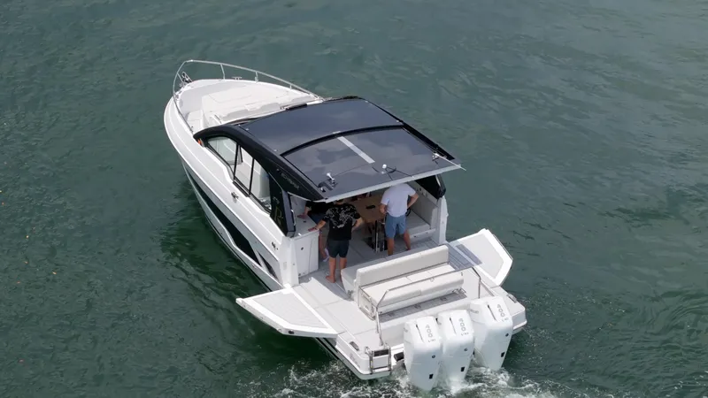 Moana & Malie Yacht Photos Pics 2025 Schaefer 375 yacht cruising on water with two people onboard.