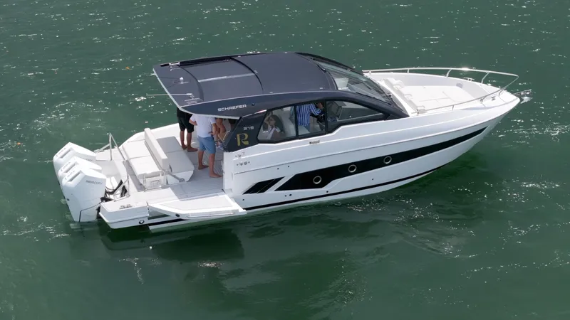 Moana & Malie Yacht Photos Pics 2025 Schaefer 375 yacht cruising on open water with passengers onboard.