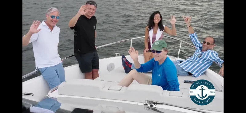 Moana & Malie Yacht Photos Pics Group enjoying on a 2025 Schaefer 375 yacht, waving and smiling on the water.