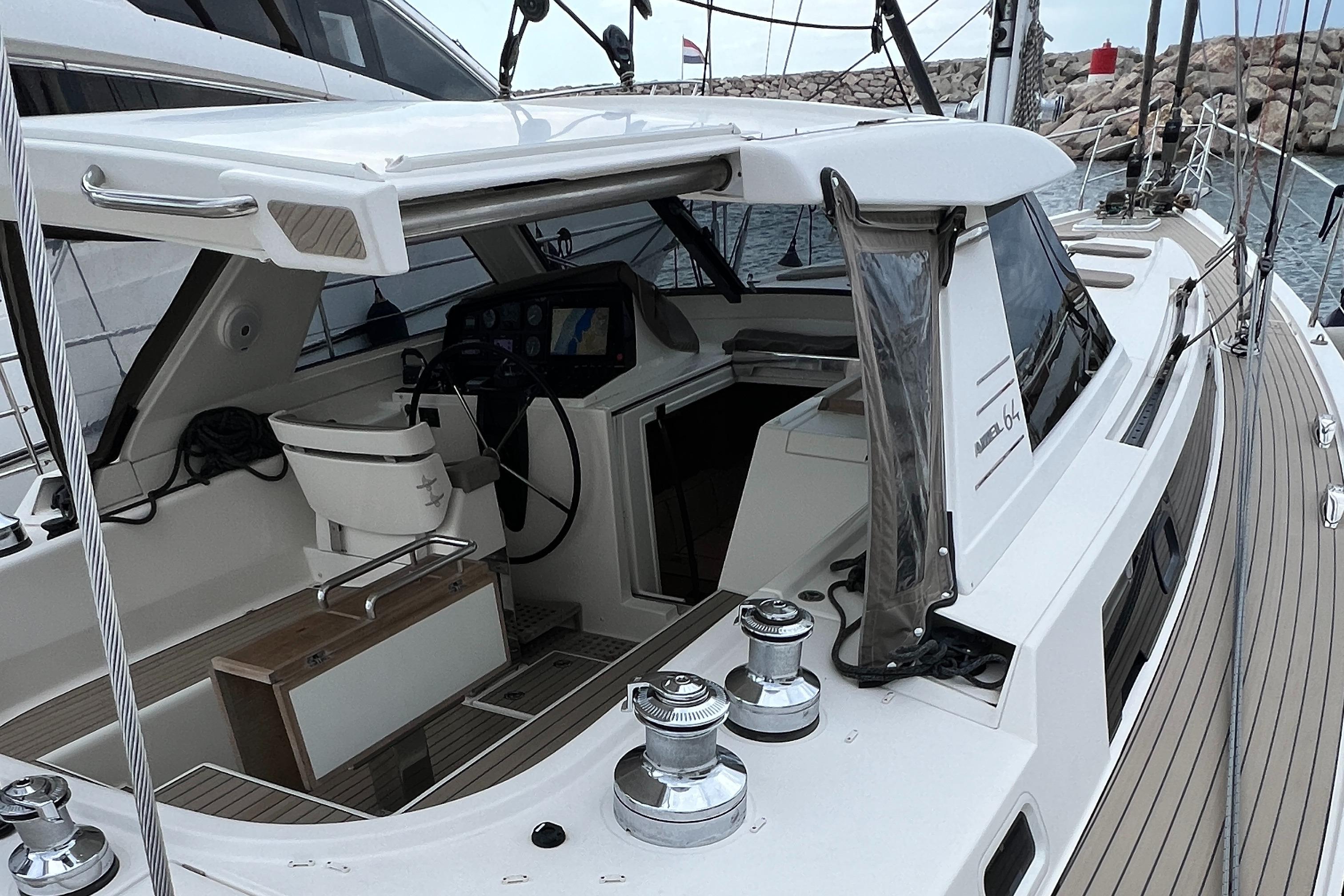 Luxury Amel 64 yacht cockpit, 2016 model, featuring modern navigation equipment and sleek design.
