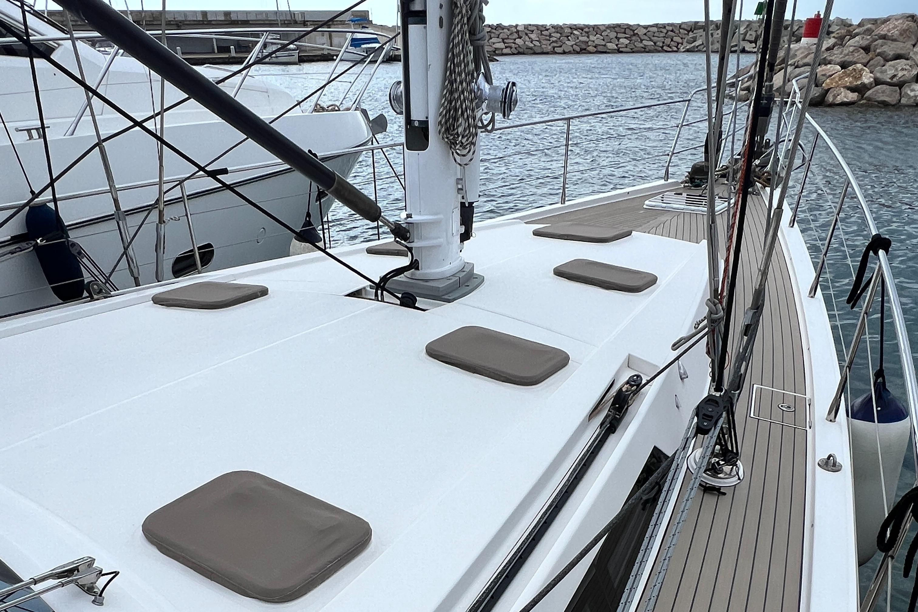 Sailing yacht Amel 64, 2016 model, docked at marina with sleek deck design.