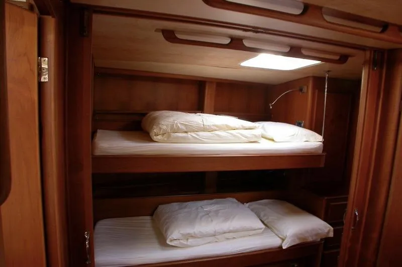 Matchless Yacht Photos Pics Interior of 1982 Chantier Naval de l&rsquo;Anitra RON HOLLAND 68 yacht with wooden bunk beds.