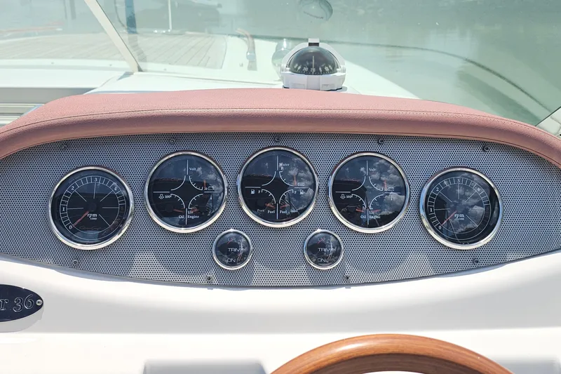 Taipan Yacht Photos Pics Dashboard of 2006 Chris-Craft Corsair 36 boat with gauges and compass.