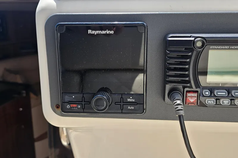 Taipan Yacht Photos Pics Raymarine and Standard Horizon equipment on 2006 Chris-Craft Corsair 36 dashboard.