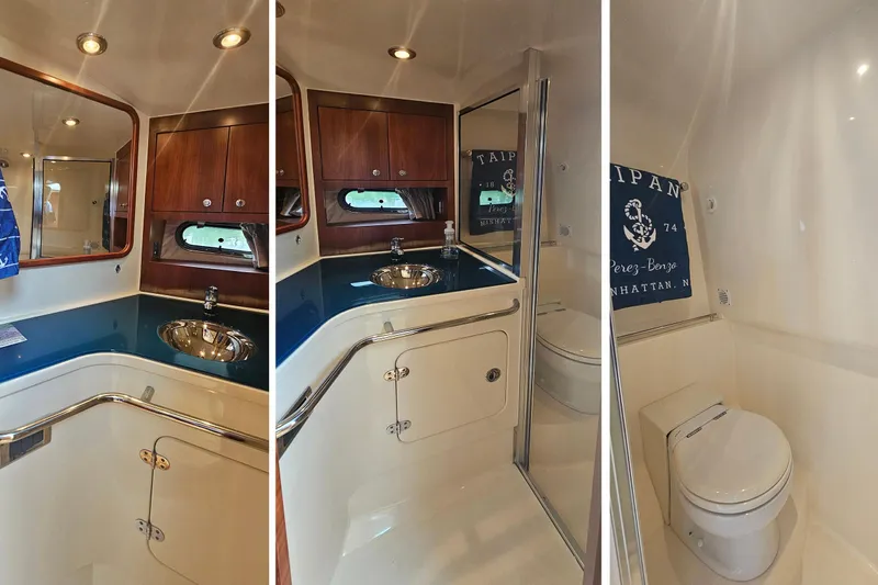 Taipan Yacht Photos Pics Luxurious 2006 Chris-Craft Corsair 36 yacht bathroom with wood accents and modern fixtures.