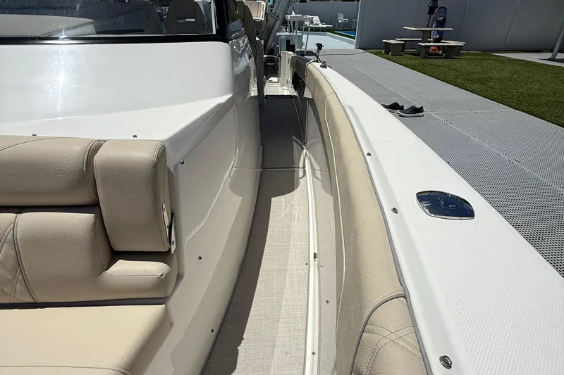  Yacht Photos Pics 2022 Regal 38 SAV boat interior with beige seating and sleek design.