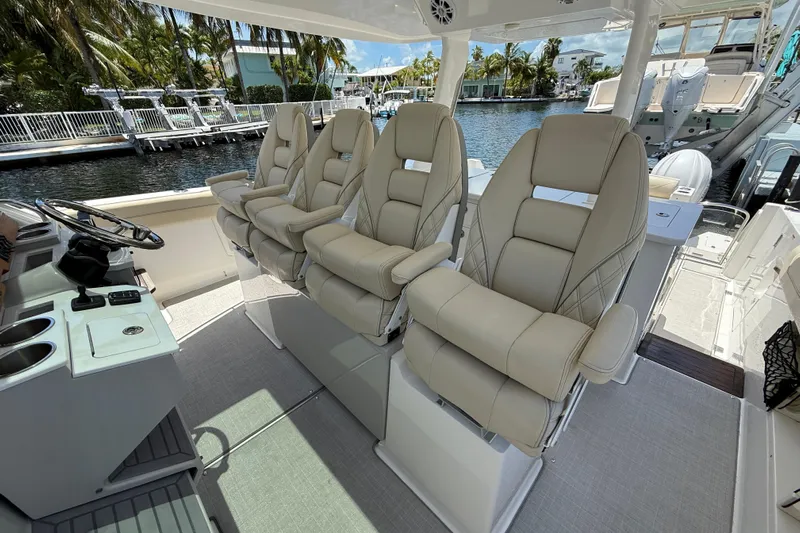  Yacht Photos Pics Luxurious seating on 2022 Regal 38 SAV boat, featuring plush, ergonomic design.