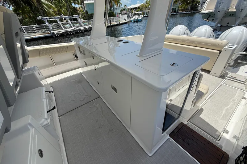  Yacht Photos Pics 2022 Regal 38 SAV boat interior with sleek cabinetry and seating by the water.