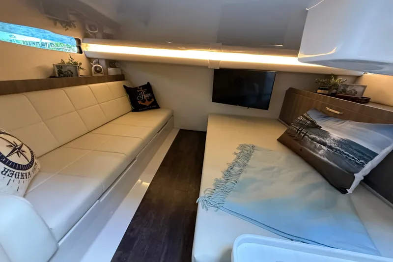  Yacht Photos Pics Luxurious interior of 2022 Regal 38 SAV yacht with cozy seating and modern decor.