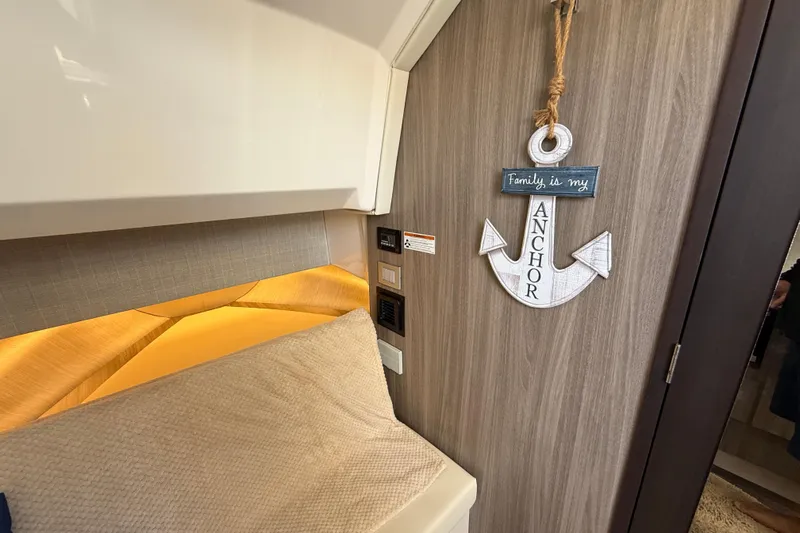  Yacht Photos Pics Cozy interior of 2022 Regal 38 SAV with anchor decor and warm lighting.