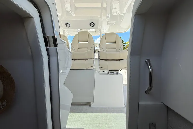  Yacht Photos Pics Interior view of 2022 Regal 38 SAV boat with luxurious seating and modern design.