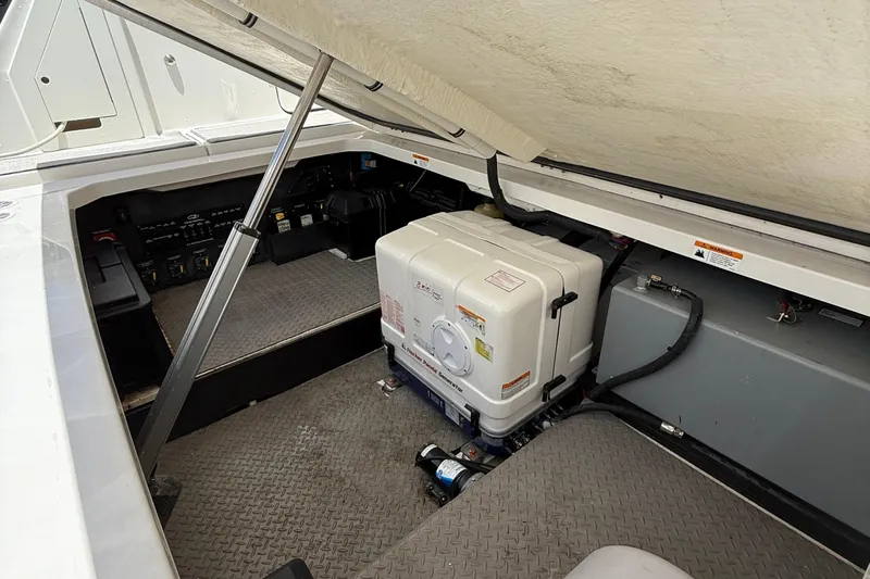  Yacht Photos Pics 2022 Regal 38 SAV engine compartment with equipment and storage space.